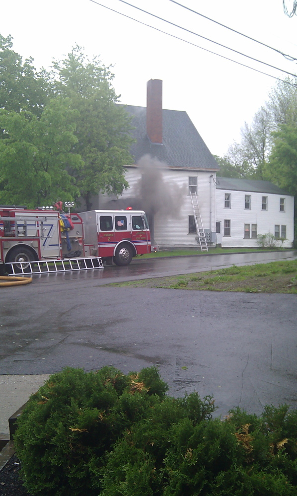APARTMENT FIRE: Smoke billows from an apartment building at 26 Pleasant St., Augusta on May 26. Onccupant John Murray, who suffered burns and smoke inhalation, later died. Earlier this month, landlord Ryan Chamberland pleaded guilty to misdemeanor criminal charges related to the fire, but those charges will be dismissed if he fixes deficiencies.