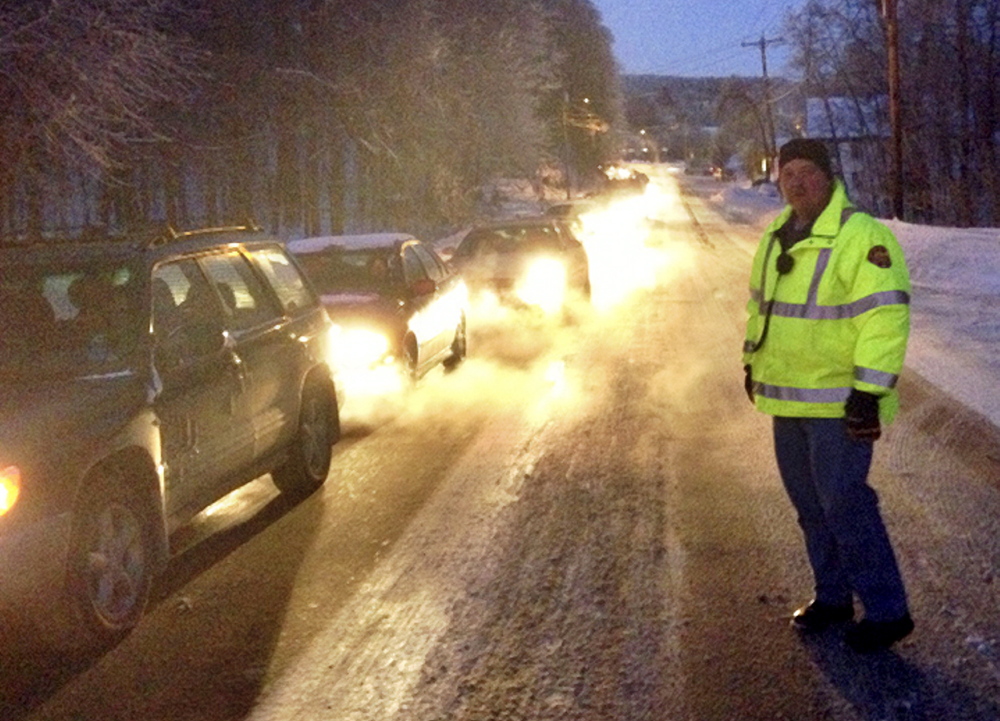 BACKED UP: Traffic is slowed to a crawl between Augusta and Gardiner on Friday following an accident on Route 201 in Hallowell on the bridge south of Greenville Street. Four cars collided on the bridge, said Hallowell Assistant Fire Chief Jeff Thompson. One person was being treated for minor injuries, Thompson said.