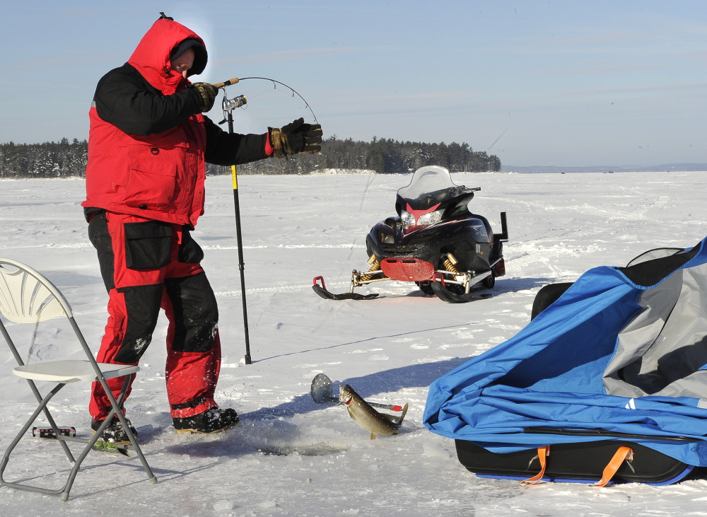 Steve Howland of South Portland catches a togue at Lower Bay.