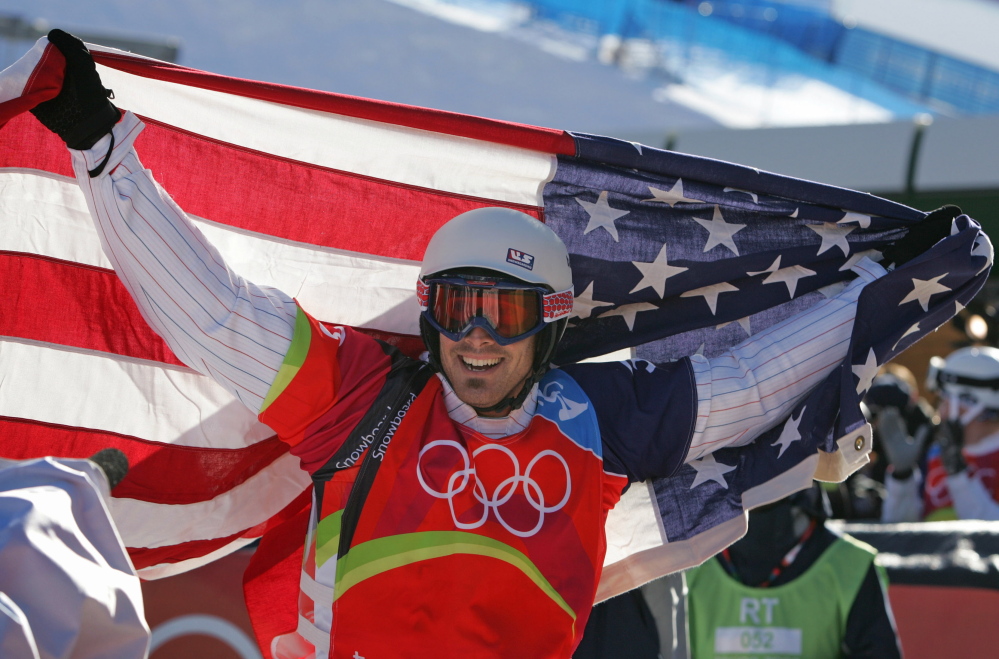 Two-time gold medalist Seth Wescott reacts after his race in the final of the snowboard cross competition at the Turin 2006 Winter Olympic Games.