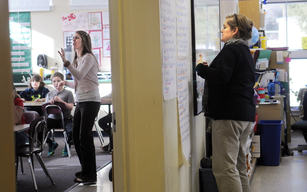 SQUEEZE: Fourth grade teachers Gretchen Nickerson, left, and Sarah Hanley instruct in a room at the Helen Thompson School in West Gardiner that is divided by a temporary wall. Nickerson teaches in the former life skills space while Hanley uses the former art studio for their classrooms.