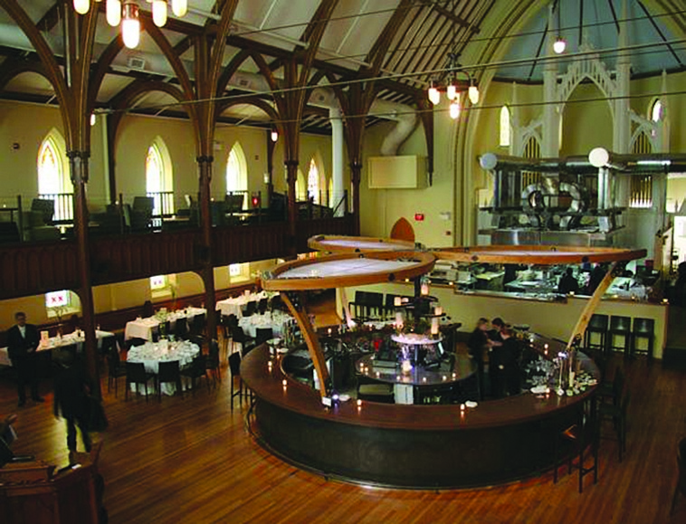 Photo contributed by Grace Looking down at the main bar area. An open kitchen is in the background on the right.