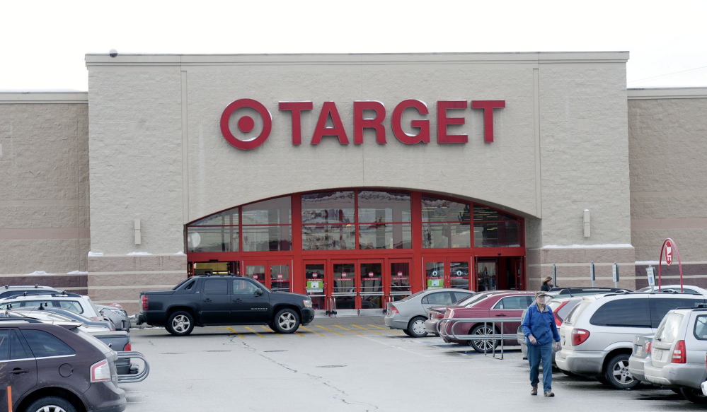 A shopper leaves Target in South Portland on Dec. 19, 2013.