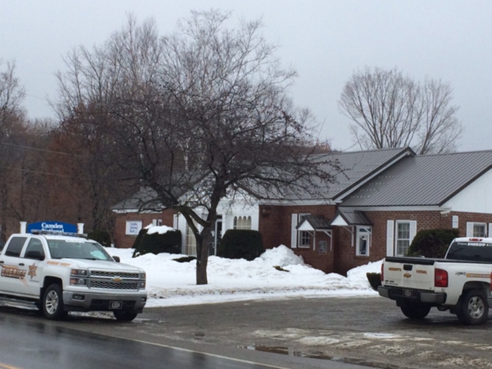 Somerset County Sheriff’s officers on scene Friday at Camden National Bank on Main Street in Bingham, which was robbed by a man armed with a hammer.