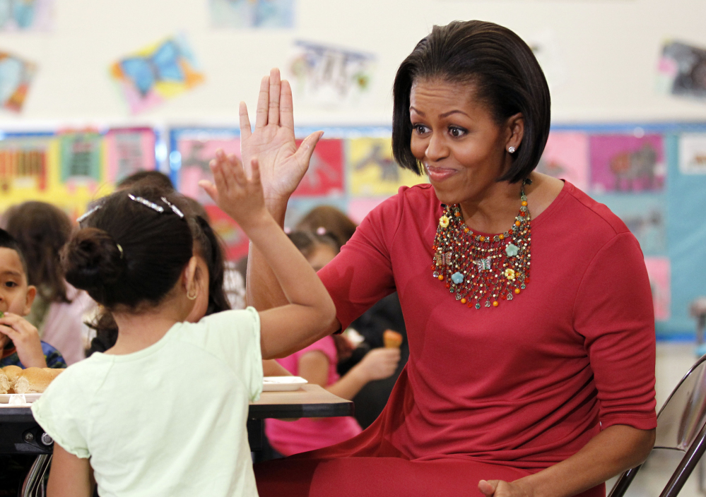 Michelle Obama sits down to eat with students during a visit to New Hampshire Elementary School in Silver Spring, Md. The first lady the first lady spent her birthday out of sight, with no public appearances after back-to-back events at the White House earlier this week.