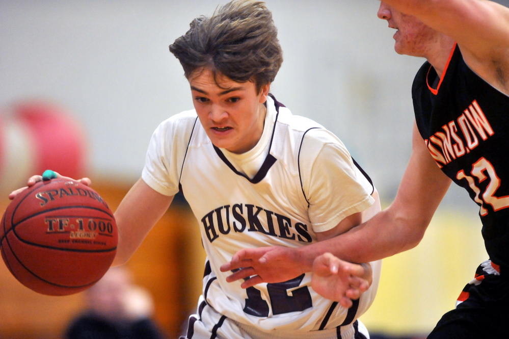 Staff photo by Michael G. Seamans Maine Central Institute's Slade Emery, 12, tries to pass Winslow High School defender Connor Wildes, 12, in Pittsfield on Friday.