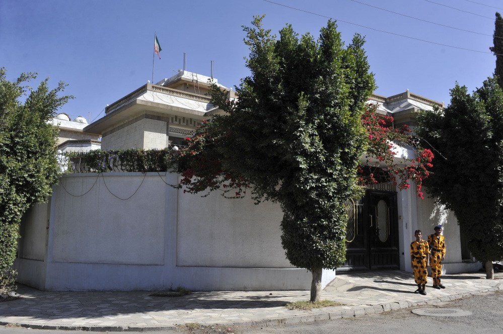 Yemeni soldiers stand guard in front of the Iranian Ambassador’s residence in Sanaa, Yemen, on Saturday. Officials in Yemen said an Iranian diplomat has been killed in a drive-by shooting in the capital, Sanaa.