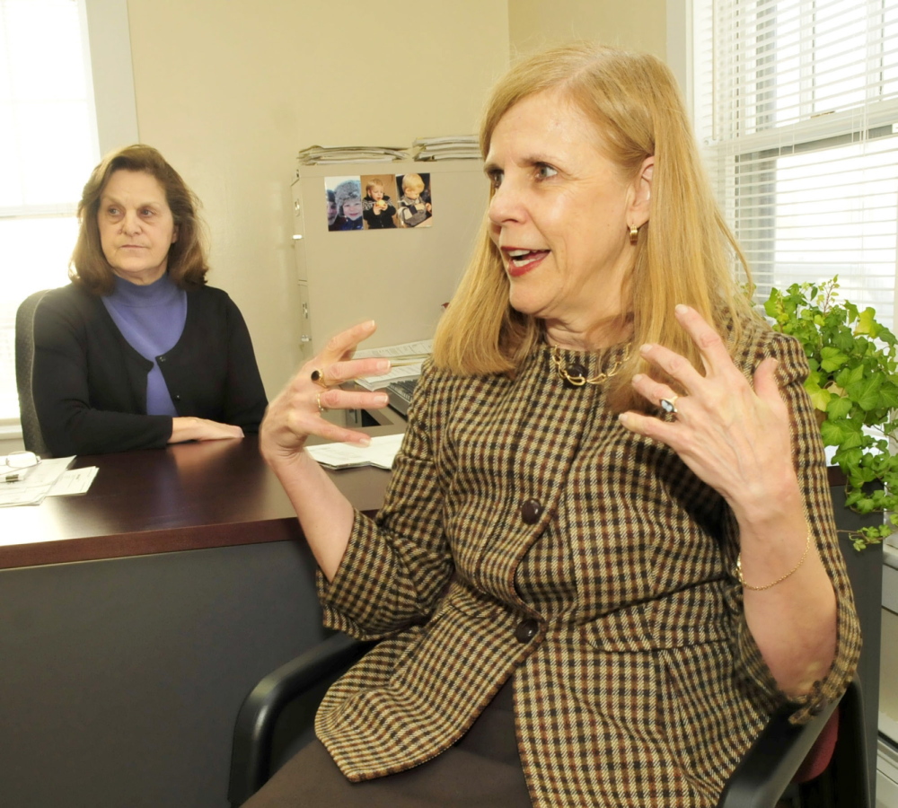 PARTNERS: Celeste Branham, right, vice president of Student and Community Services at the University of Maine in Farmington, and grant writer Lorraine Pratt discuss the Partnership for Civic Advancement program, which assists students with internship opportunities.