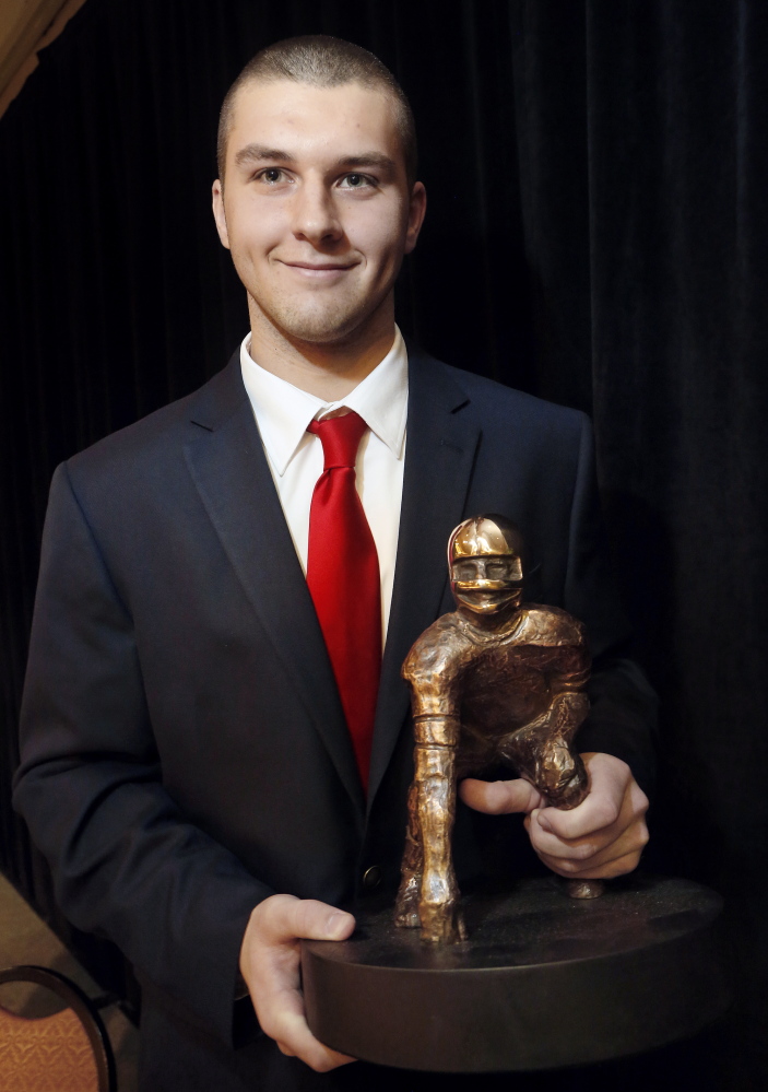 Derek Davis/Staff Photographer: Ben Lucas, quarterback for Cony High School, won the James L. Fitzpatrick Trophy, Sunday, Jan. 19, 2014, at Holiday Inn by The Bay in Portland.