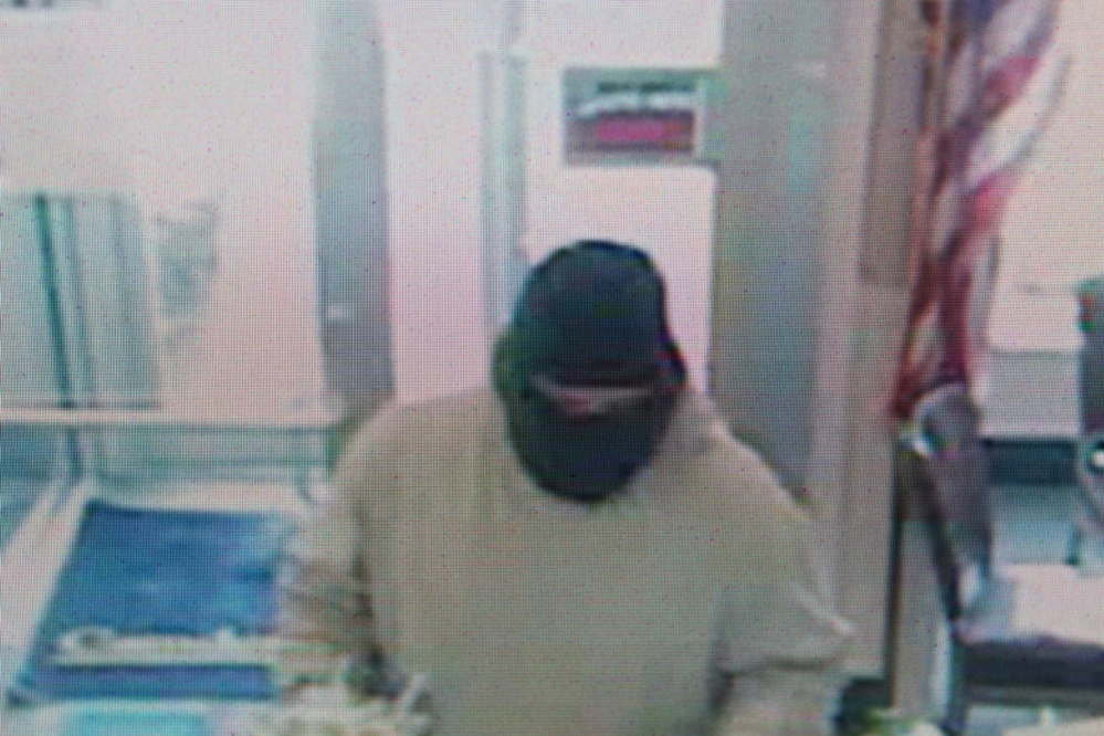 ROBBERY SUSPECT: Police have released this surveillance image of a man who robbed Camden National Bank in Bingham last Friday, armed with a hammer.