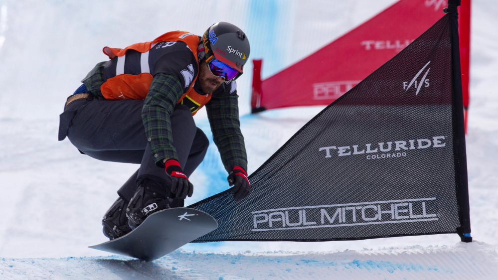 Seth Wescott snowboards past a gate at the snowboard cross team World Cup event in Telluride, Colo., in 2012.