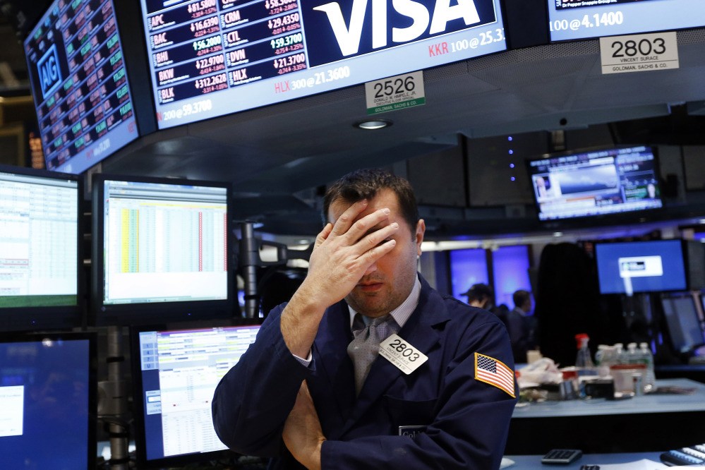 Specialist Vincent Surace works on the floor of the New York Stock Exchange on Friday.