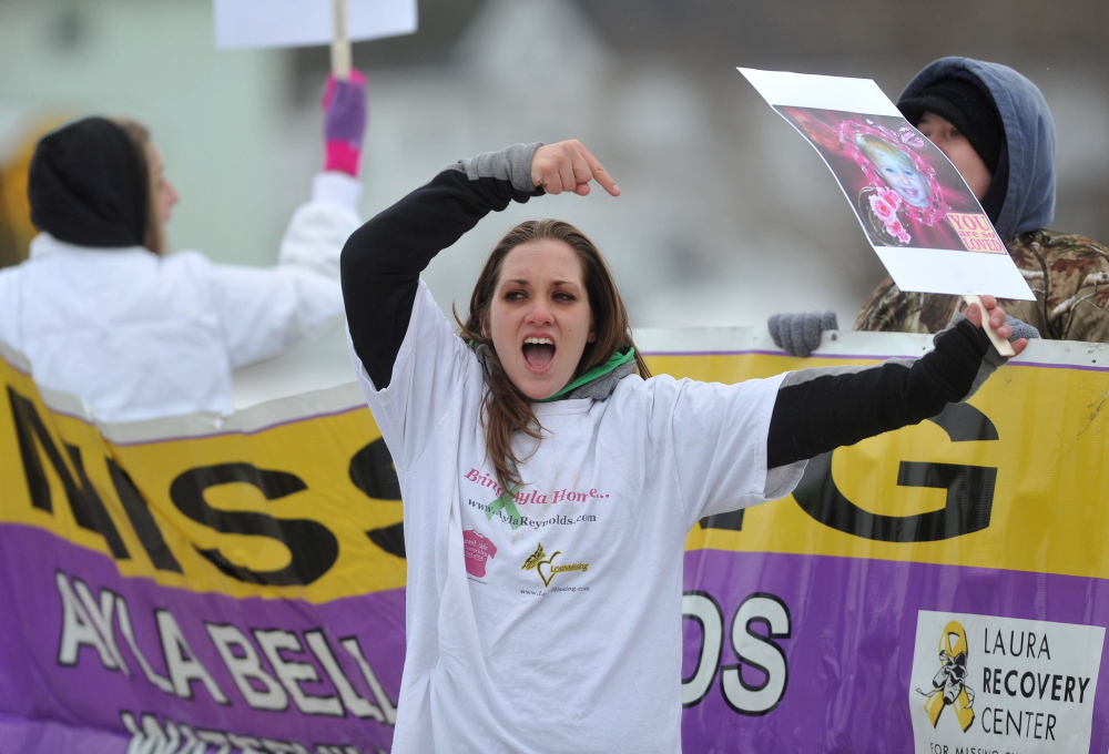 Trista Reynolds, mother of missing toddler Ayla Reynolds, holds a picture of her daughter Saturday in Waterville.