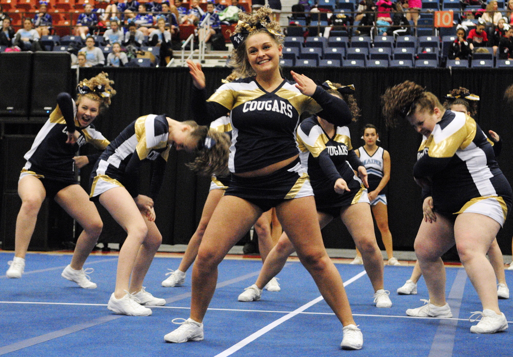 Staff photo by Joe Phelan Mount Blue Cougars perform during the Class A East cheering championship on Saturday January 25, 2014 in the Augusta Civic Center.
