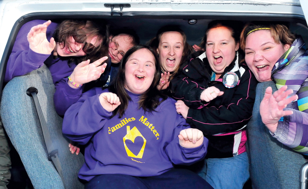 All smiles: These athletes from Families Matter Inc. in Waterville show their enthusiasm as they arrive for the 45th annual Special Olympics Maine Winter Games at Sugarloaf USA on Sunday. The games begin Monday with alpine and nordic skiing, snowshoeing and skating with the help of coaches and hundreds of volunteers. From left are Ashley Cayouette, Ronnie Hood, Caitlin Killarney, front, Shirley Stevens, Shelly Ambrose and Tiffany Carter.