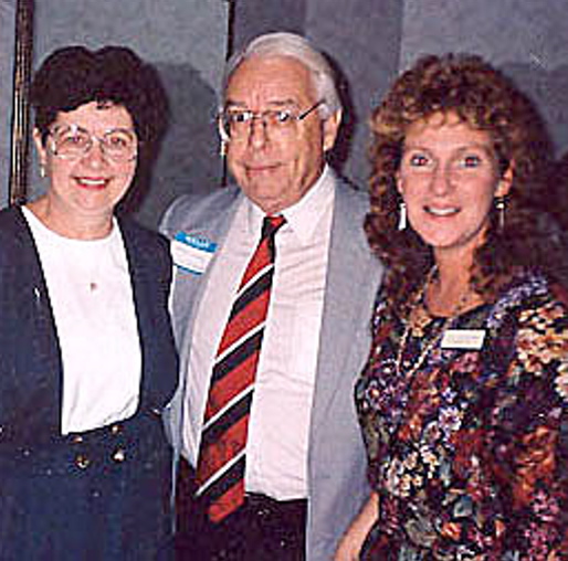 TOGETHER: Walter Simcock is surrounded by former Mid-Maine Chamber of Commerce employees Audrey Harding, left, and Jill Van Gorden.