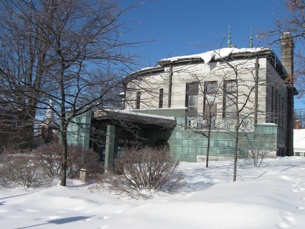 SEEKING INCREASE: Farmington Public Library is at the corner of Academy and High streets. The library, a non-profit organization that contracts with the town, is seeking a budget increase, which has been recommended by the town’s budget committee, but not by selectmen.