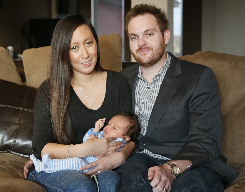 Jennifer Rogers and her husband Nyle Rogers hold Jack Nicolas Rogers in their home in Edmond, Okla., recently. Jack was born Dec. 21, 2013.