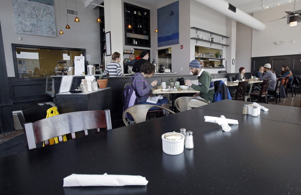 Customers eat lunch at Bonbon Pastry and Cafe in Cleveland. At the cafe in the city’s Market Square district, last weekend was especially slow with whiteout conditions making going outside unappealing for customers.