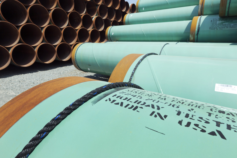 In this May 24, 2012, photo, about 500 miles worth of coated steel pipe manufactured by Welspun Pipes Inc. for the Keystone oil pipeline is stored in Little Rock, Ark.