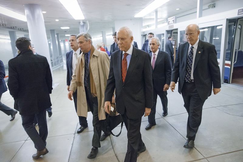 In this Jan. 16 file photo, Republican lawmakers arrive at the Capitol as the Senate votes to approve a $1.1 trillion spending package. Congress is revisiting its decision to cut annual cost-of living adjustments to pensions for most working-age military retirees after talk of the cuts drew outrage from veterans groups.