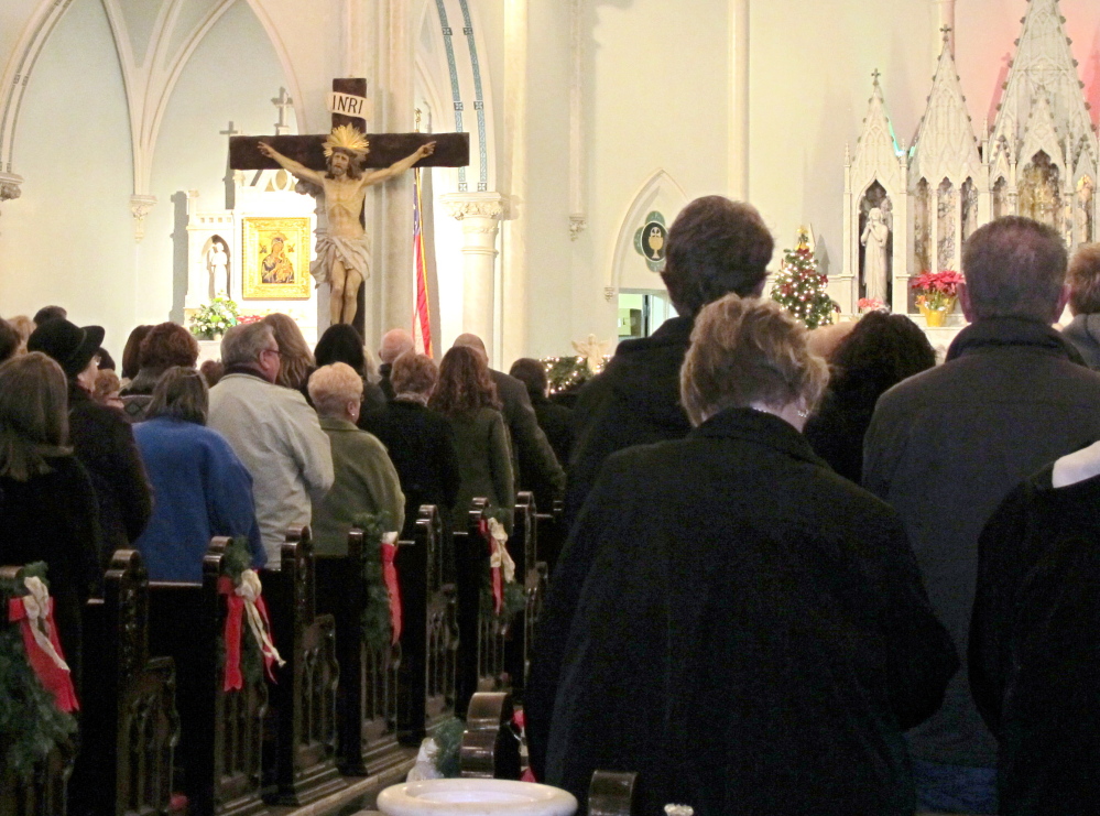 People fill Our Lady of Perpetual Help Church in Buffalo, N.Y. The attendance of a Mass mob rallied by social media is a financial help to some sparsely attended churches.