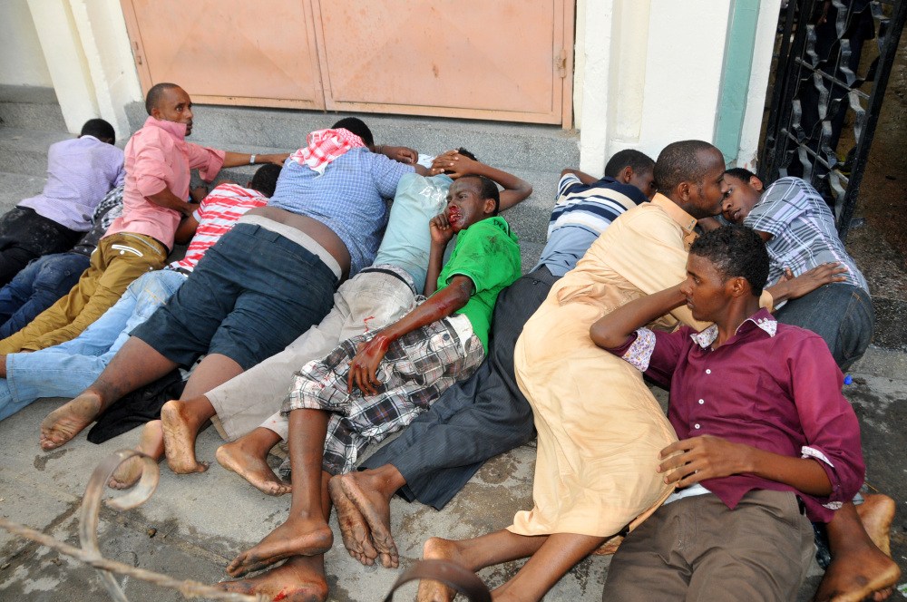 Some of the Muslim youths lie on the ground after they were arrested inside the Masjid Musa Mosque during riots in Mombasa between Muslim youths and riot police in Majengo, Mombasa, Kenya, on Sunday.