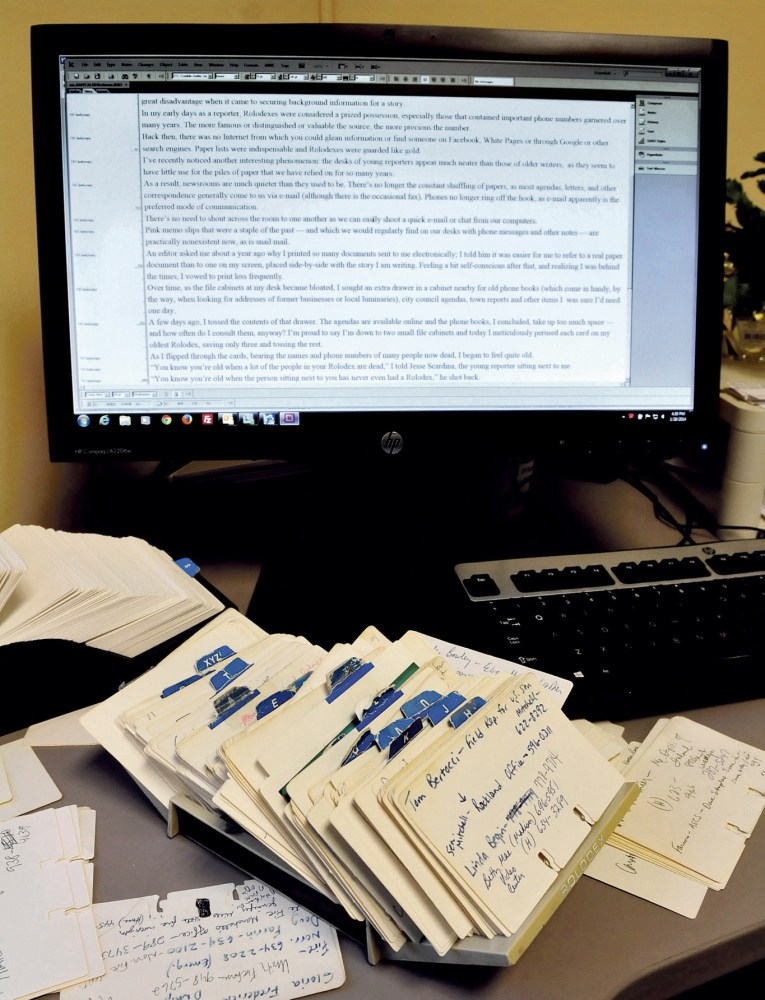 LESS PAPER: Paper and related items like a Rolodex are becoming overshadowed by computers and other mechanical means.