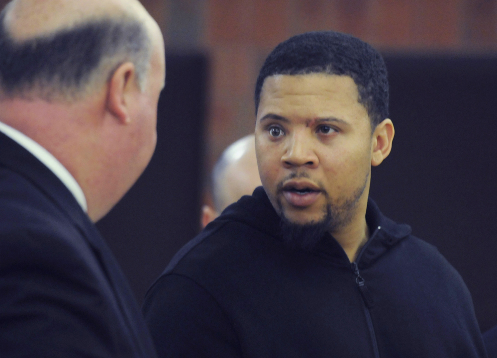 Alexander Bradley, right, talks with his attorney Robert Pickering during a court appearance at Hartford Superior Court on in Hartford, Conn., on Oct. 4, 2013.