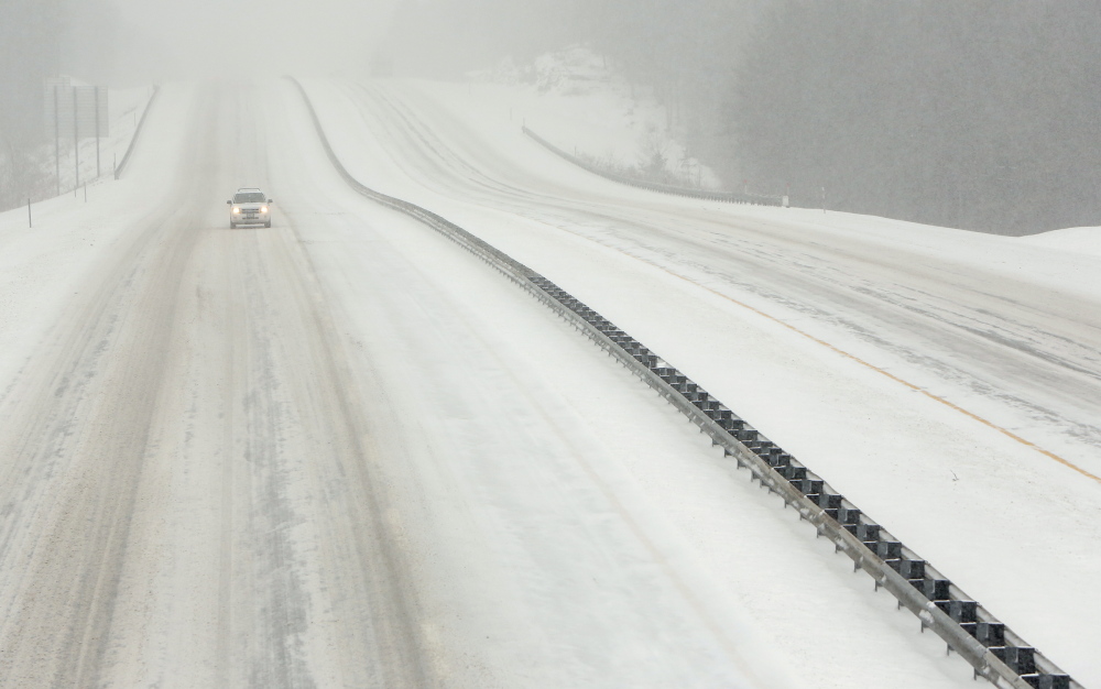 An SUV travels northbound on a deserted stretch of the Maine Turnpike in Kennebunk on Wednesday.