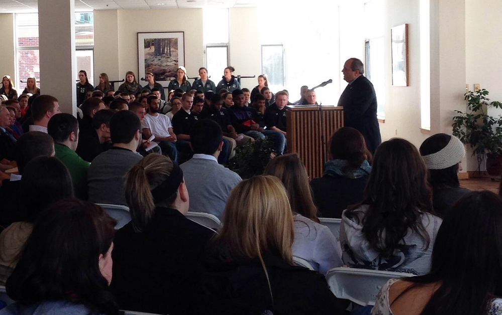 Remember: Husson University President Robert A Clark speaks to hundreds of students and faculty who turned out Friday to remember Stephen Colvin, a student who died Tuesday while skiing on Sugarloaf.