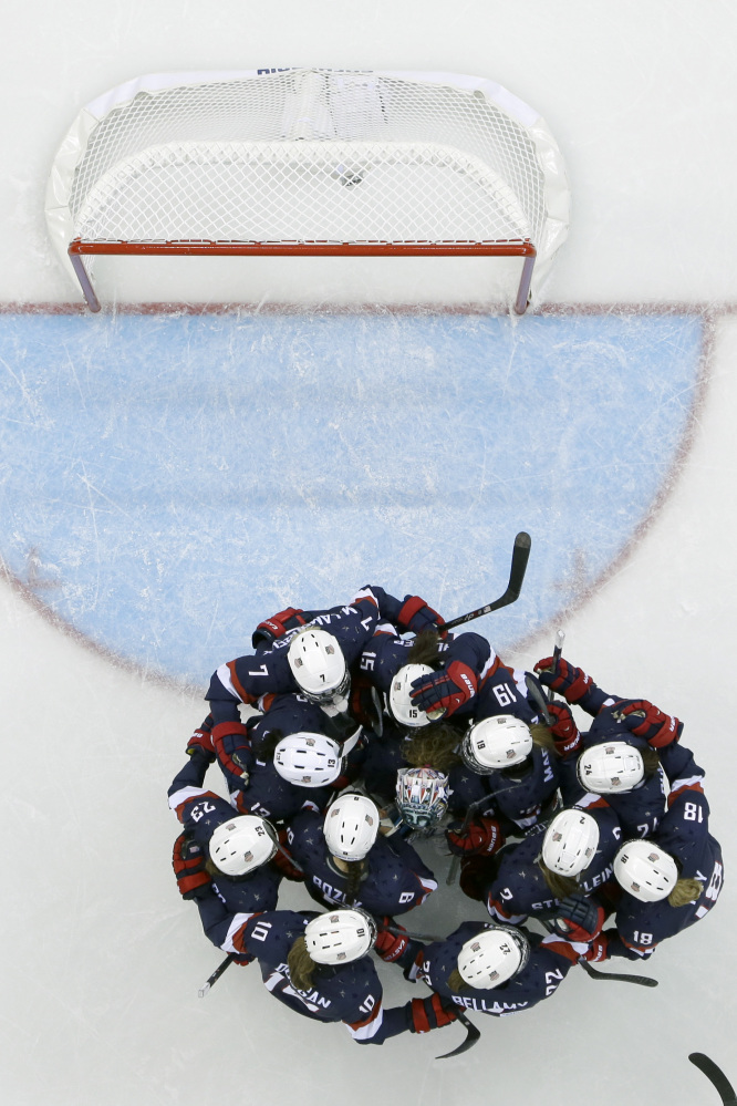 The USA women’s hockey team celebrates its 3-1 win over Finland during at the Shayba Arena during the 2014 Winter Olympics, Saturday, Feb. 8.