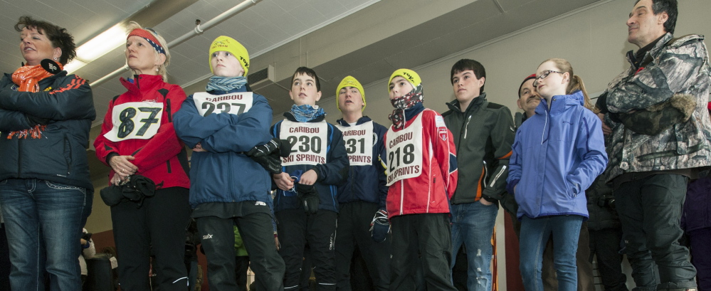 Televisions showing a live-stream of the Olympics 10K biathlon sprint, in which Russell Currier competed Saturday, draw a crowd at the Options RTO store in downtown Caribou. Many of the viewers took a break from competing in the Caribou Downtown Ski Festival to watch Currier, who grew up in nearby Stockholm. The only Maine native in the Games, Currier finished 61st in a field of 87 with a time of 26:58.5.