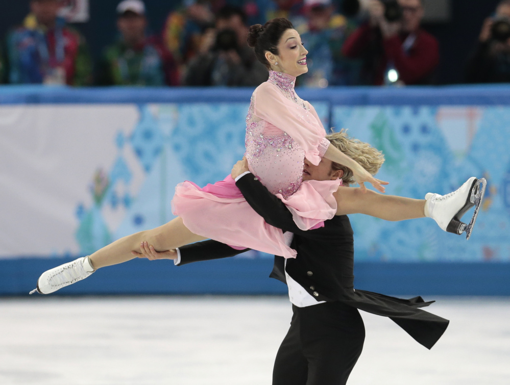 Meryl Davis and Charlie White of the United States compete in the team ice dance short dance figure skating competition at the Iceberg Skating Palace during the 2014 Winter Olympics on Saturday Sochi, Russia.