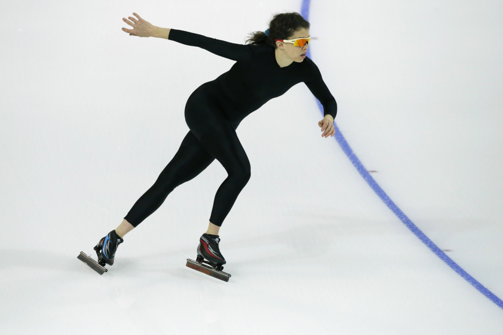 Maria Lamb of the U.S. skates in a black suit after changing her official US Speedskating team suit during a training session at the Adler Arena Skating Center at the 2014 Winter Olympics, Friday, Feb. 14, 2014, in Sochi, Russia. The team thought it had a chance to do something special, given some impressive World Cup results this season and new high-tech suits from Under Armour, which got an assist in the design from aerospace giant Lockheed Martin. Now, there’s plenty of grumbling that the suits are actually slowing the skaters down in Sochi.