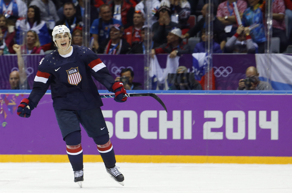 USA forward T.J. Oshie reacts after scoring the winning goal in a shootout against Russia during overtime of a men’s hockey game at the 2014 Winter Olympics on Saturday in Sochi, Russia.