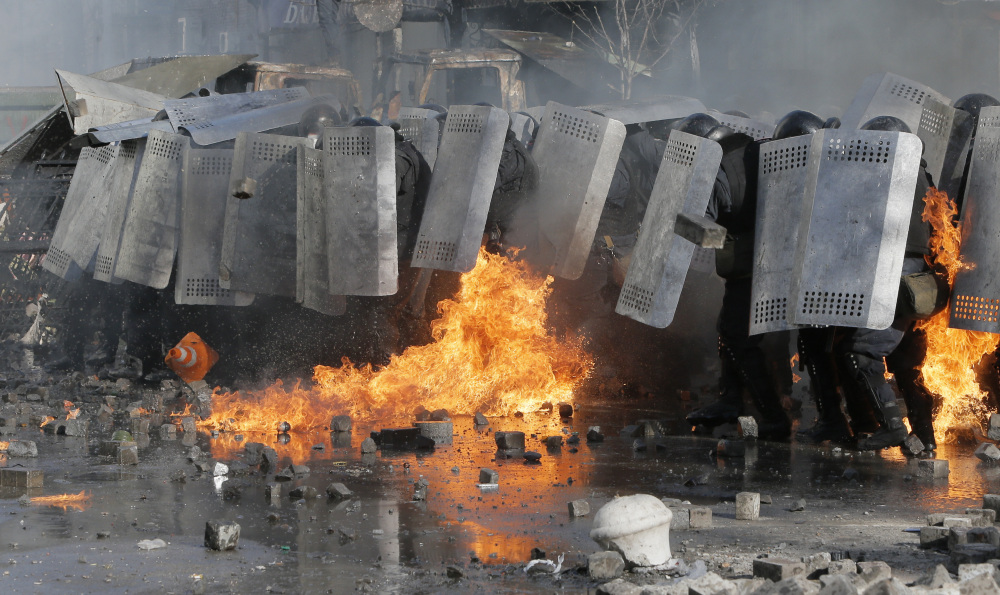 Riot police clash with anti-government protesters outside Ukraine’s parliament in Kiev, Ukraine, on Tuesday. Some thousands of anti-government protesters clashed with police in a new eruption of violence Tuesday.
