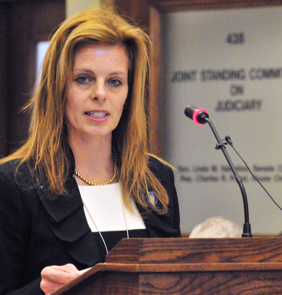 Staff photo by Joe Phelan Rep. Amy Volk, R-Scarborough, introduces her bill LD 1730, "An Act To Assist Victims of Human Trafficking" during a Judiciary Committee public hearing on Thursday February 20, 2014 at the State House in Augusta.