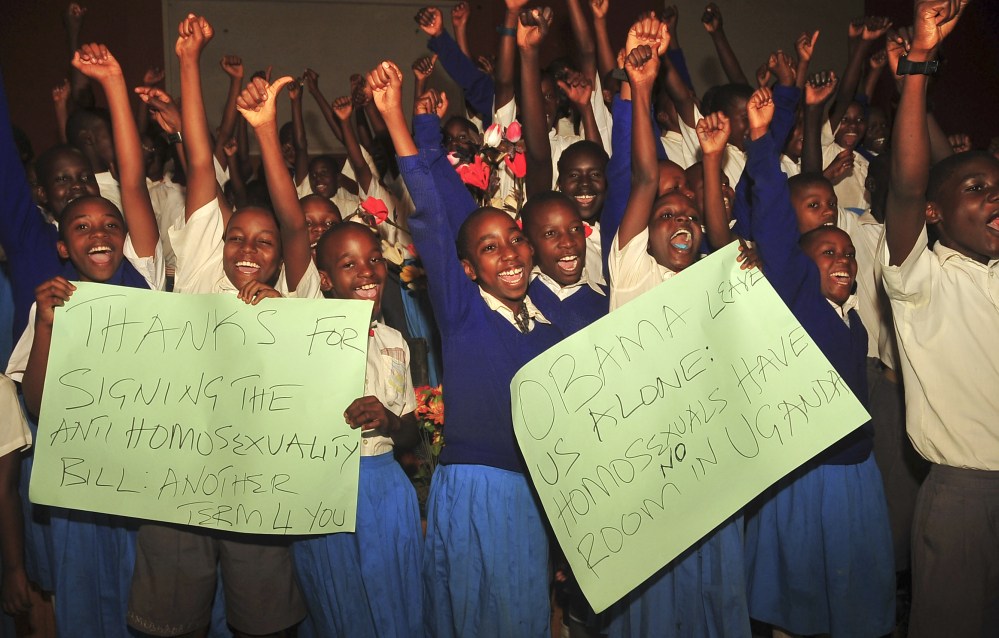 Ugandan pupils from different schools take part in an event organised by born-again Christians to celebrate the signing of a new anti-gay bill that sets harsh penalties for homosexual sex, at the Omega Healing Center outside of Kampala, in Uganda Monday, Feb. 24, 2014. Uganda’s President Yoweri Museveni on Monday signed the controversial anti-gay bill into law, with penalties including 14 years in jail for first-time offenders and life imprisonment as the maximum penalty for “aggravated homosexuality”, saying it is needed to deter what he called the West’s “social imperialism” promoting homosexuality in Africa.