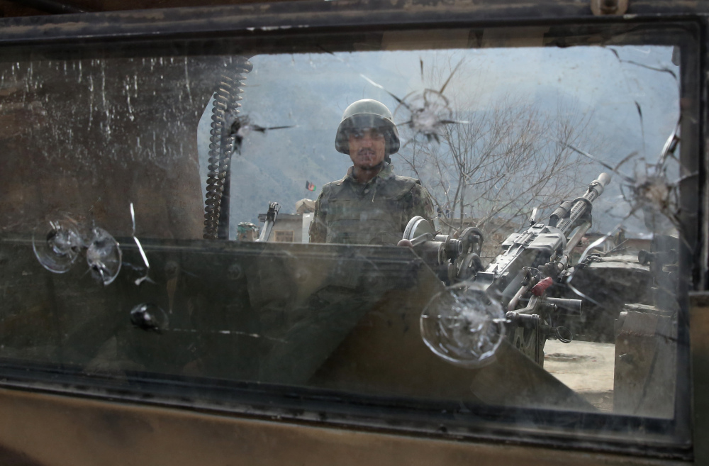 An Afghan National Army soldier stands guard in the Narai military camp in the Ghazi Abad district in Kunar province on Monday. U.S. officials say the inexperienced Afghan forces aren’t ready to take over the task of rooting out Al-Qaida unaided.