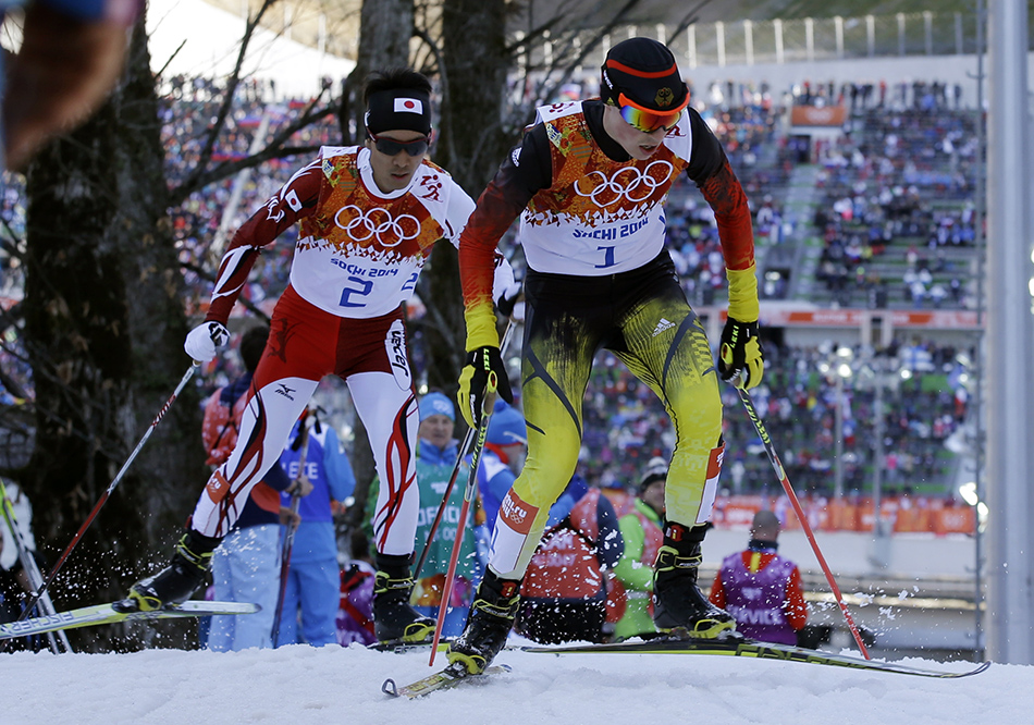 Germany's gold medal winner Eric Frenzel, right, and Japan's silver medal winner Akito Watabe ski during the cross-country portion of the Nordic combined at the 2014 Winter Olympics, Wednesday, Feb. 12, 2014, in Krasnaya Polyana, Russia.