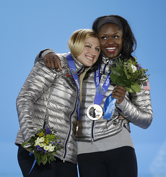 Women's bobsleigh bronze medalists Jamie Greubel, left, and Aja Evans of the United States embrace one another during their medals ceremony at the 2014 Winter Olympics, Thursday, Feb. 20, 2014, in Sochi, Russia. (AP Photo/David Goldman) 2014 Sochi Olympic Games;Winter Olympic games;Olympic games;Spor