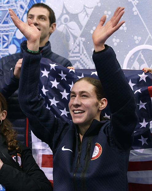 Jason Brown of the United States waves to spectators as he waits for his results after competing in the men's team free skate figure skating competition at the Iceberg Skating Palace during the 2014 Winter Olympics, Sunday, Feb. 9, 2014, in Sochi, Russia.