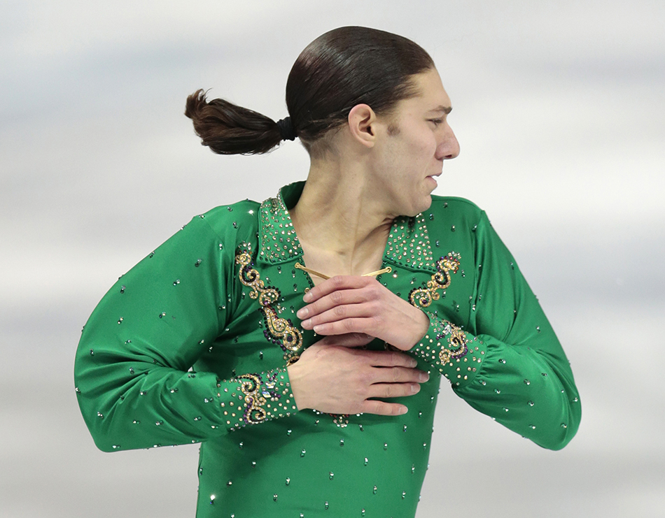 Jason Brown of the United States competes in the men's team free skate figure skating competition at the Iceberg Skating Palace during the 2014 Winter Olympics, Sunday, Feb. 9, 2014, in Sochi, Russia.