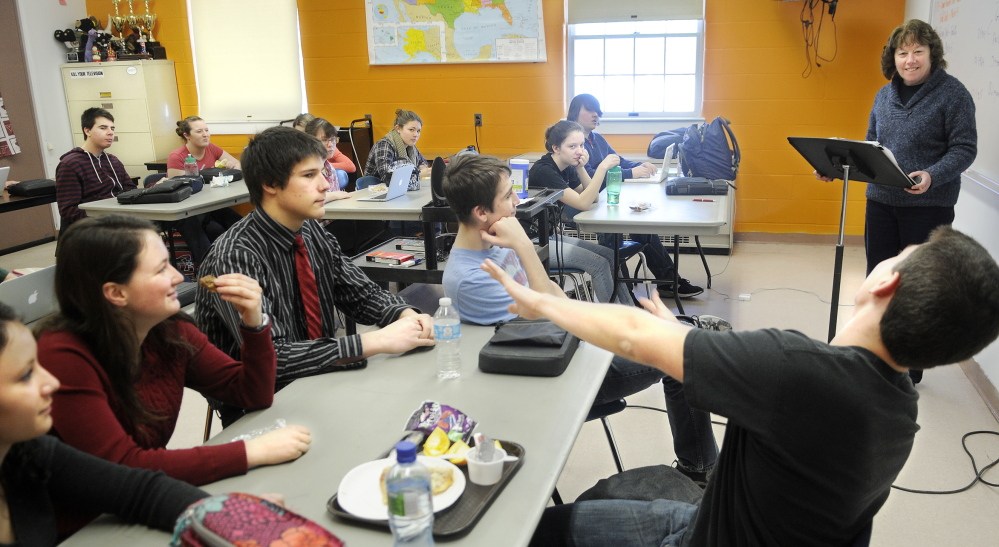 Staff file photo by Joe Phelan CONDITIONING: Teacher Cathy Foyt challenges members of Monmouth Academy’s Academic Decathon team last month. The team placed second behind Scarborough High School in the all-day decathlon last Saturday.