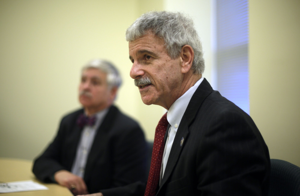 Assistant Senate Republican Leader Roger Katz, right, and Sen. Thomas Saviello, discuss details of their proposal to expand Medicaid under the Affordable Care Act while implementing other significant changes to the program on Tuesday at the State House in Augusta. A legislative committee endorsed their plan by a 7-5 vote Monday.