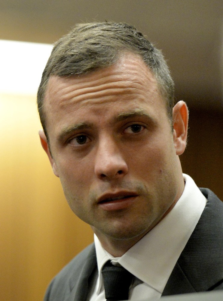 Oscar Pistorius inside the high court in Pretoria, South Africa, Monday. The state says Pistorius intentionally killed Reeva Steenkamp by shooting her through a toilet door after an argument.