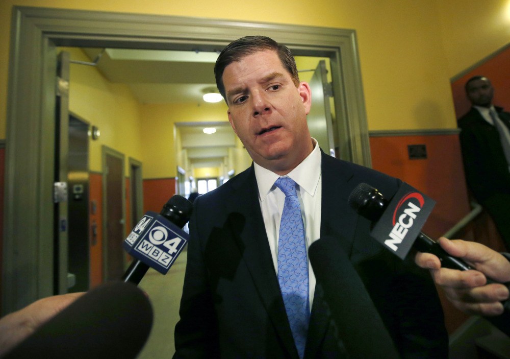 Mayor Martin Walsh speaks to reporters in this Feb. 27, 2014, photo. A MassEquality official said a group of gay military veterans can march under its banner as part of a deal brokered by Walsh. But marchers from the gay-rights group would not be allowed to wear clothing or hold signs that refer to sexual orientation.