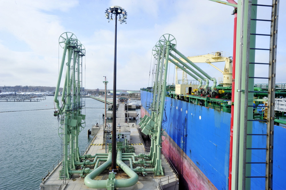 A tanker offloads oil at one of Portland Pipe Line Corp.’s terminals in South Portland. Since the 1940s, the company has pumped oil from the terminals through a 236-mile pipeline that leads to refineries in Montreal.