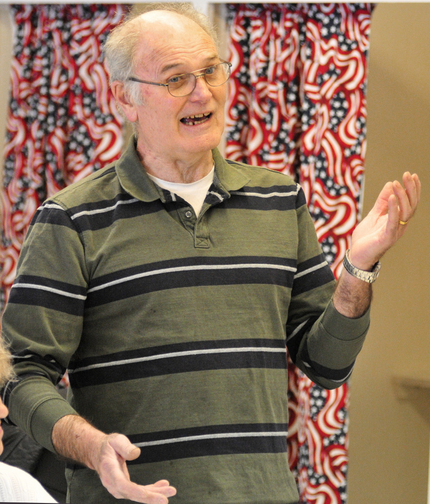 EXPLANATION: Third selectman Paul Anderson answers a question during a debate Saturday at the Rome Town Meeting .
